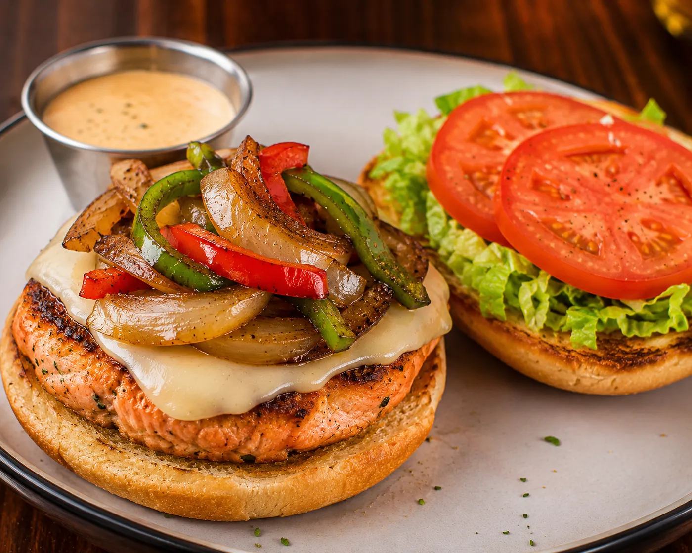 Grilled salmon burger with provolone, peppers and onions at Buzz City